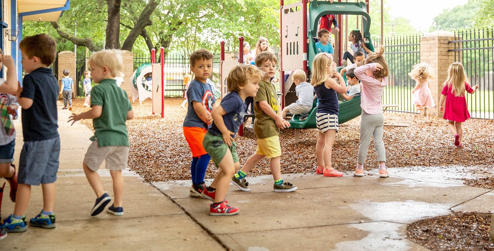 preschool students playing on the playground