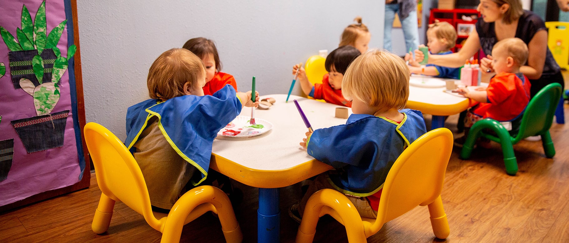 nursery school students painting