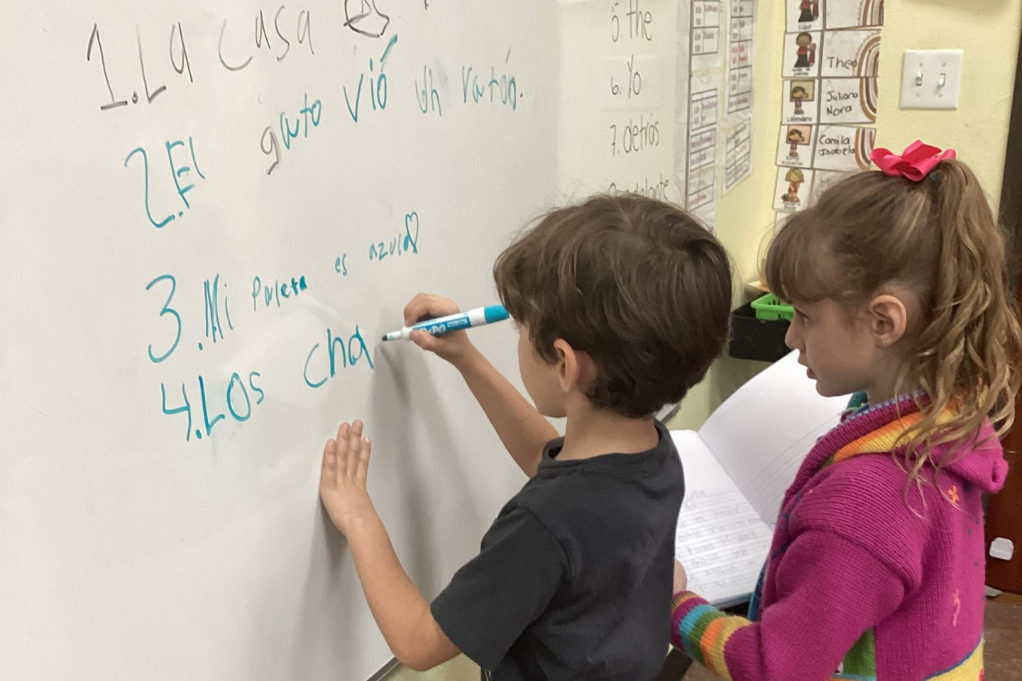 students working at the white board