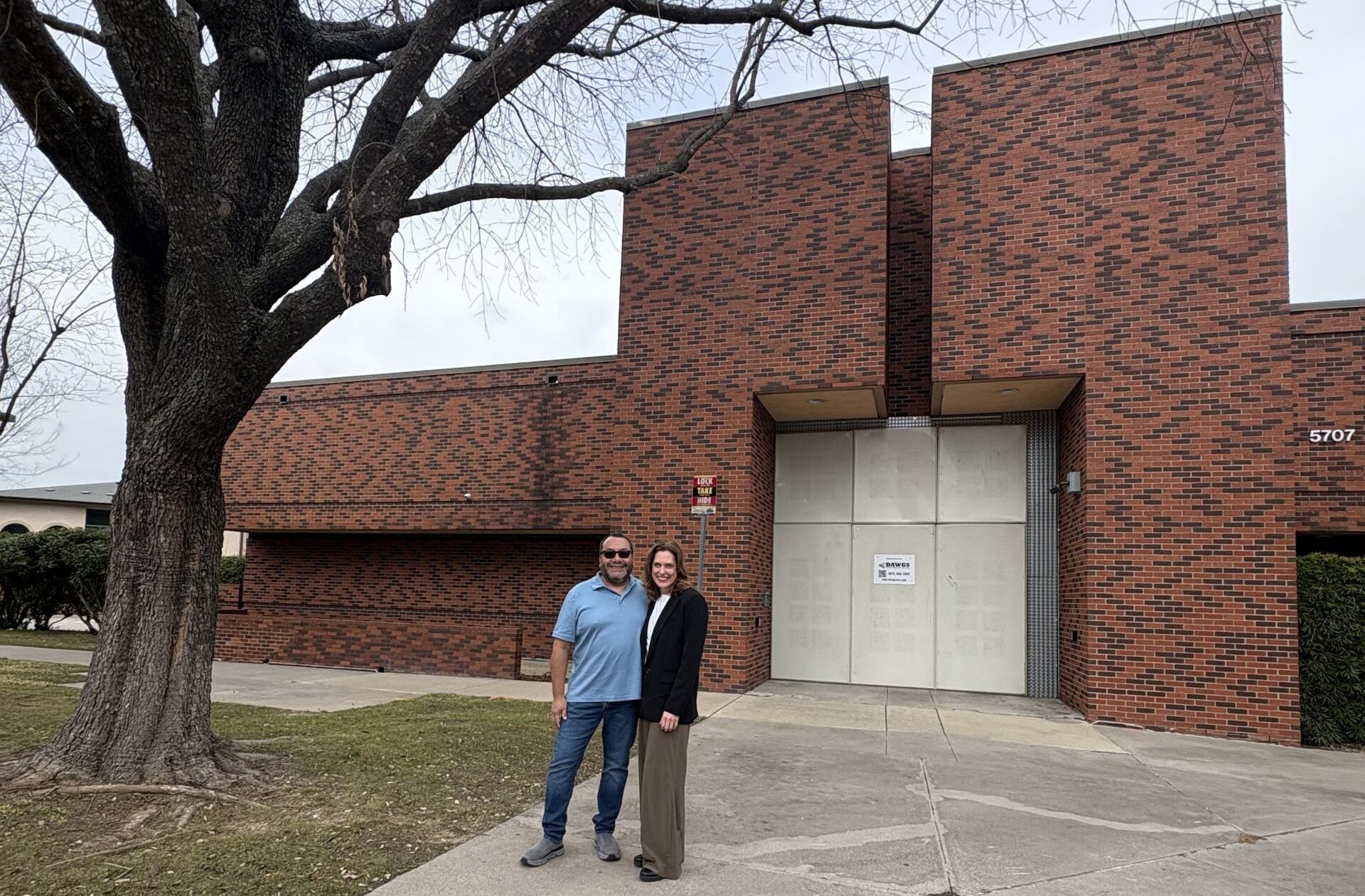 Luis Martinez and Catherine Wallace standing outside the new Southwestern Campus